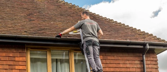 our team cleaning the gutters on a house in Stoke Bishop, St Helens